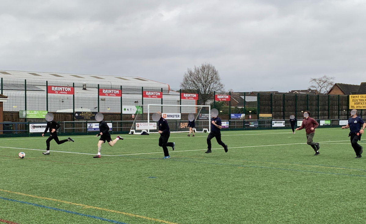 Students playing football alongside staff from the fire service, Family Support Service and Child Exploitation Team