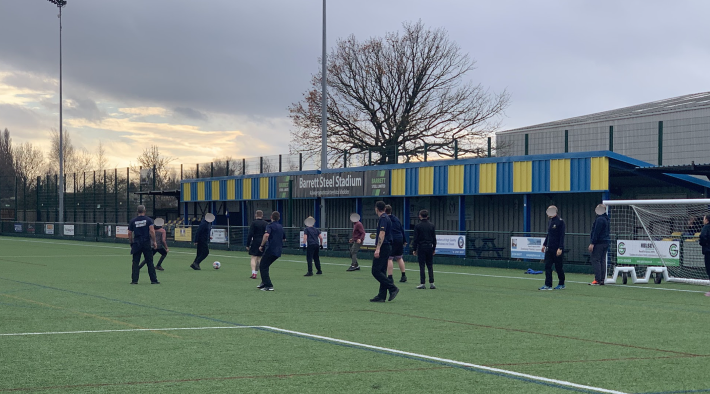 Students and staff from partner agencies together at a Pledge2Learn community football event