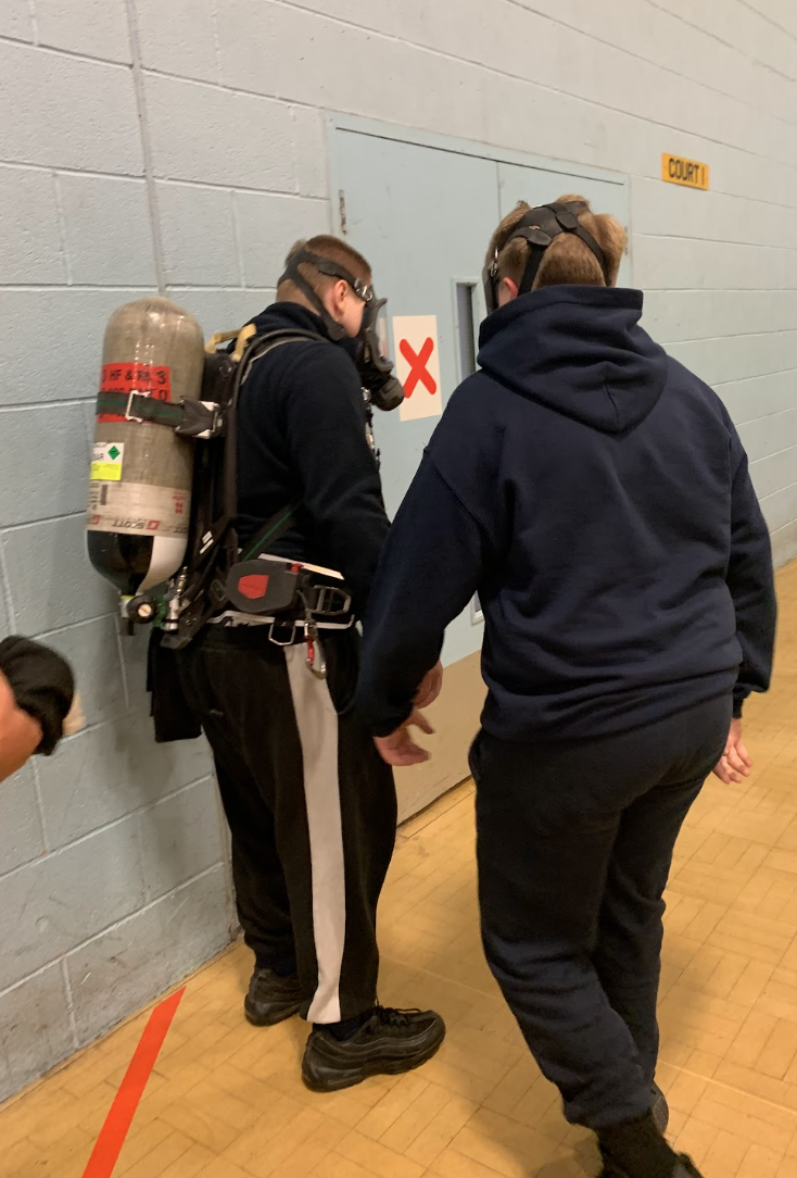 Students taking part in a rescue exercise with the fire service